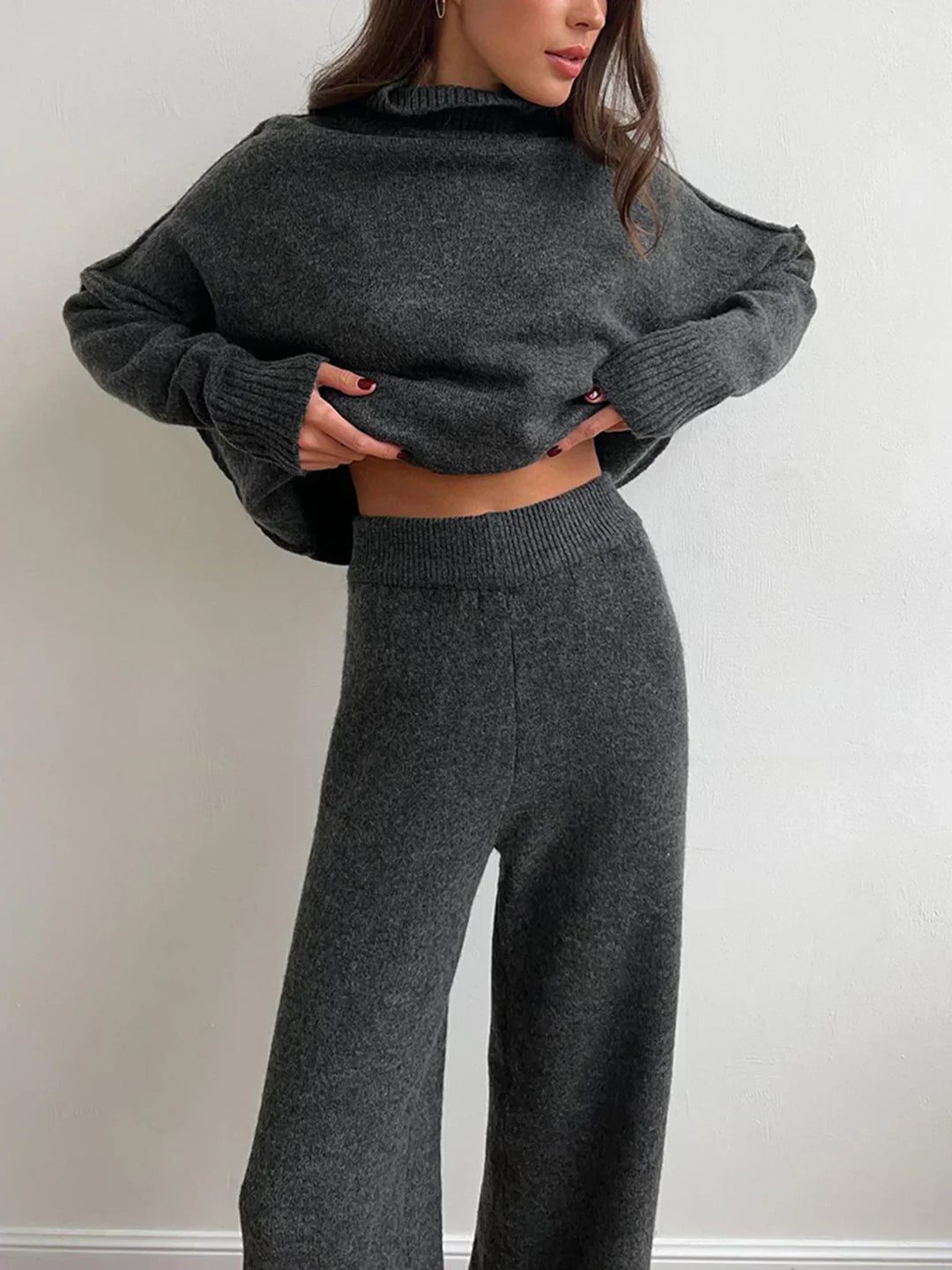 Knitted set with high collar and trousers