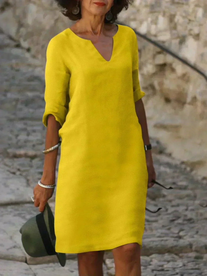 Emery – Elegant and refined dress that covers the belly